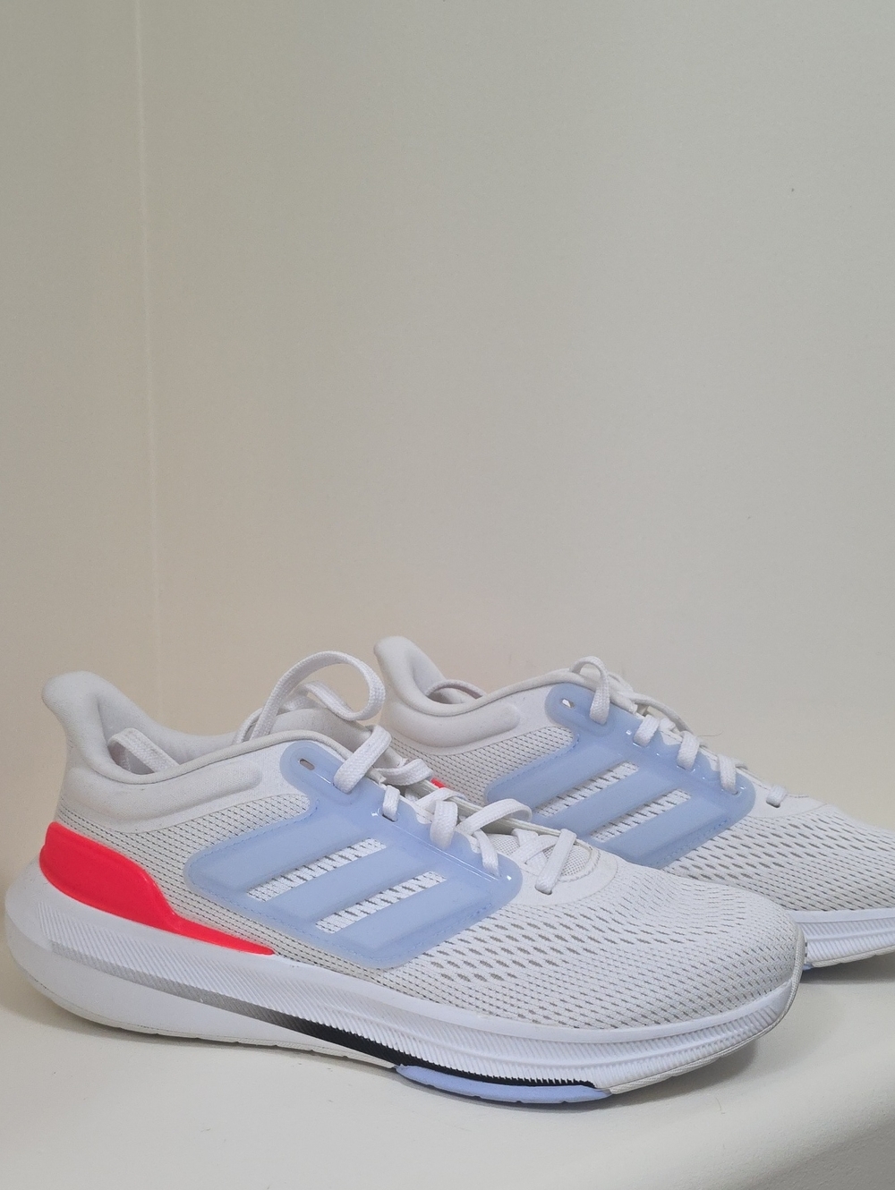 adidas White Athletic Shoes with Light Blue Overlays and Pink Heel Accent